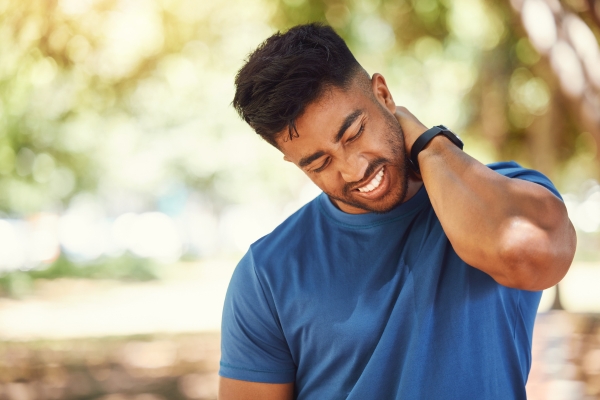 young man experiencing neck pain